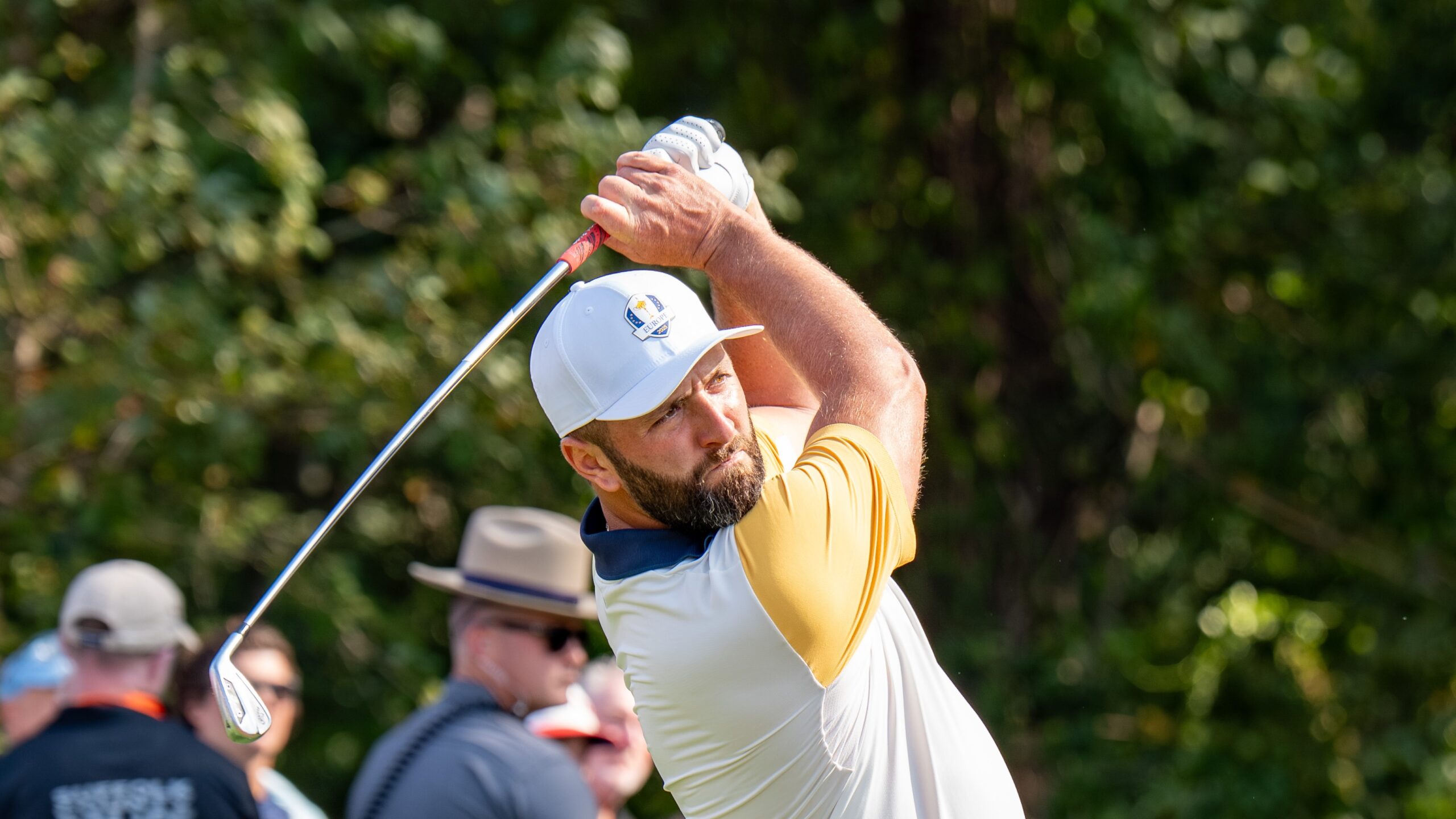Jon Rahm swinging a golf club during the 2025 Ryder Cup