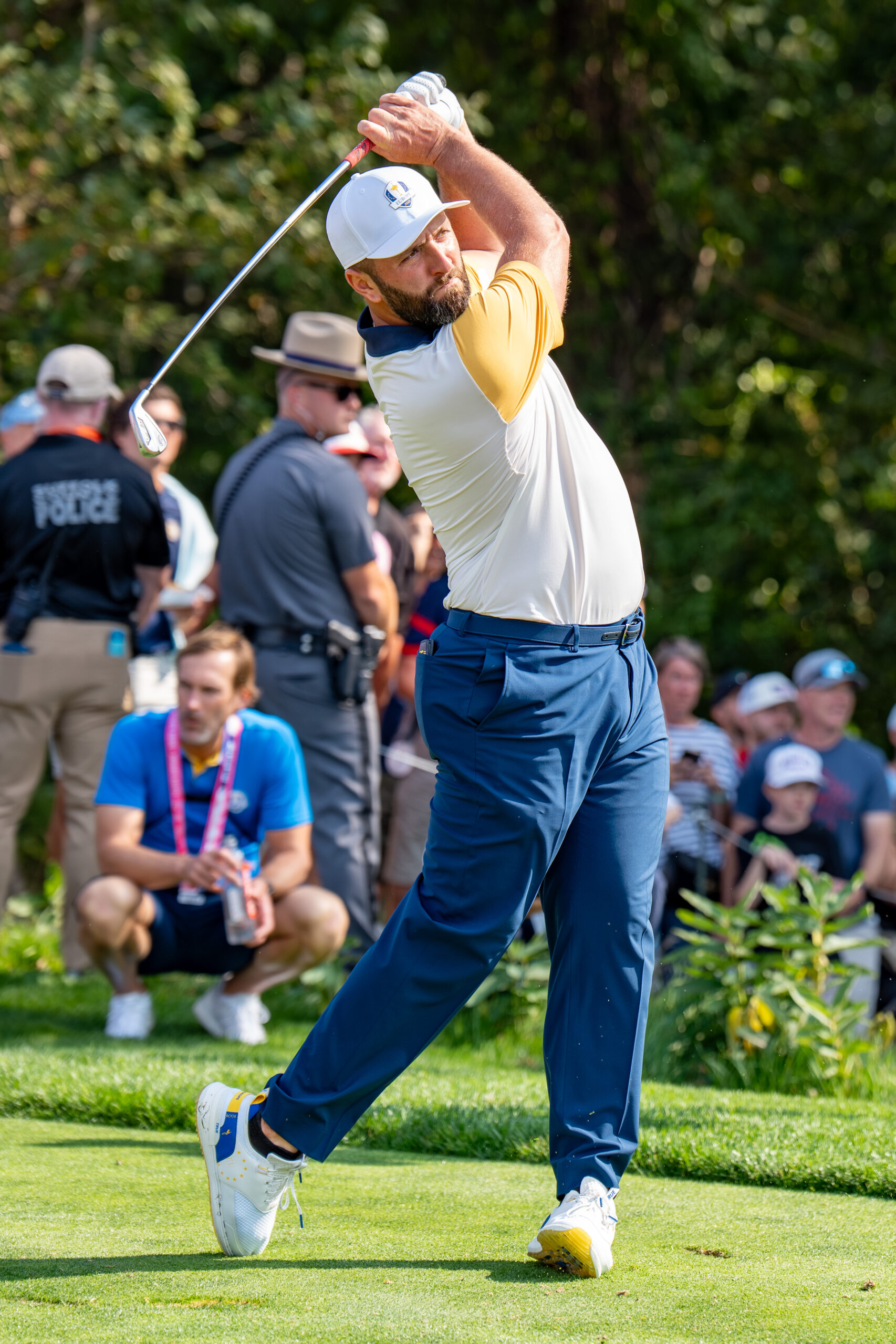 Jon Rahm swinging a golf club during the 2025 Ryder Cup