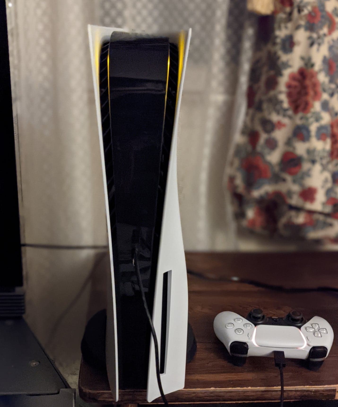 A PlayStation 5 console and DualSense controller