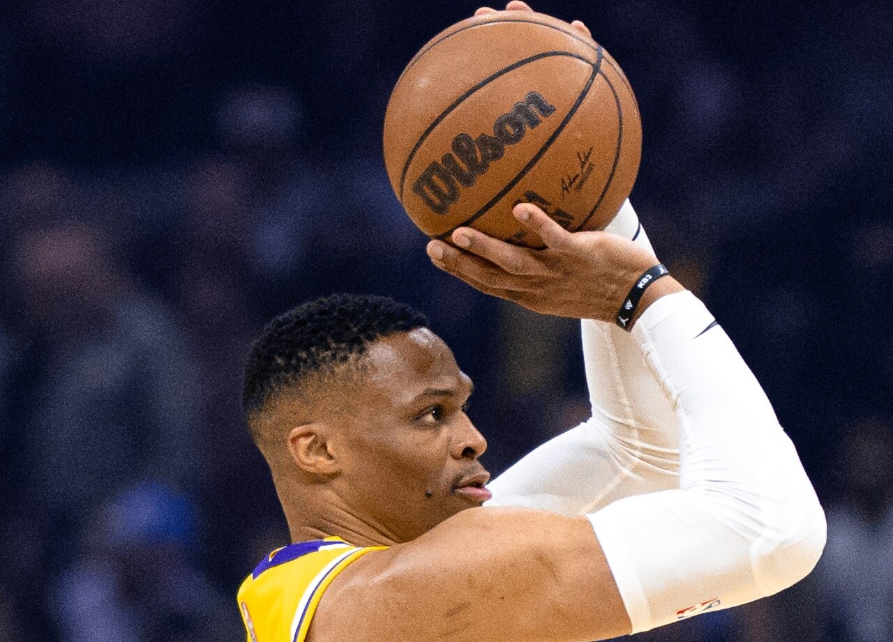 Russell Westbrook shooting during an NBA game, wearing a Lakers uniform.