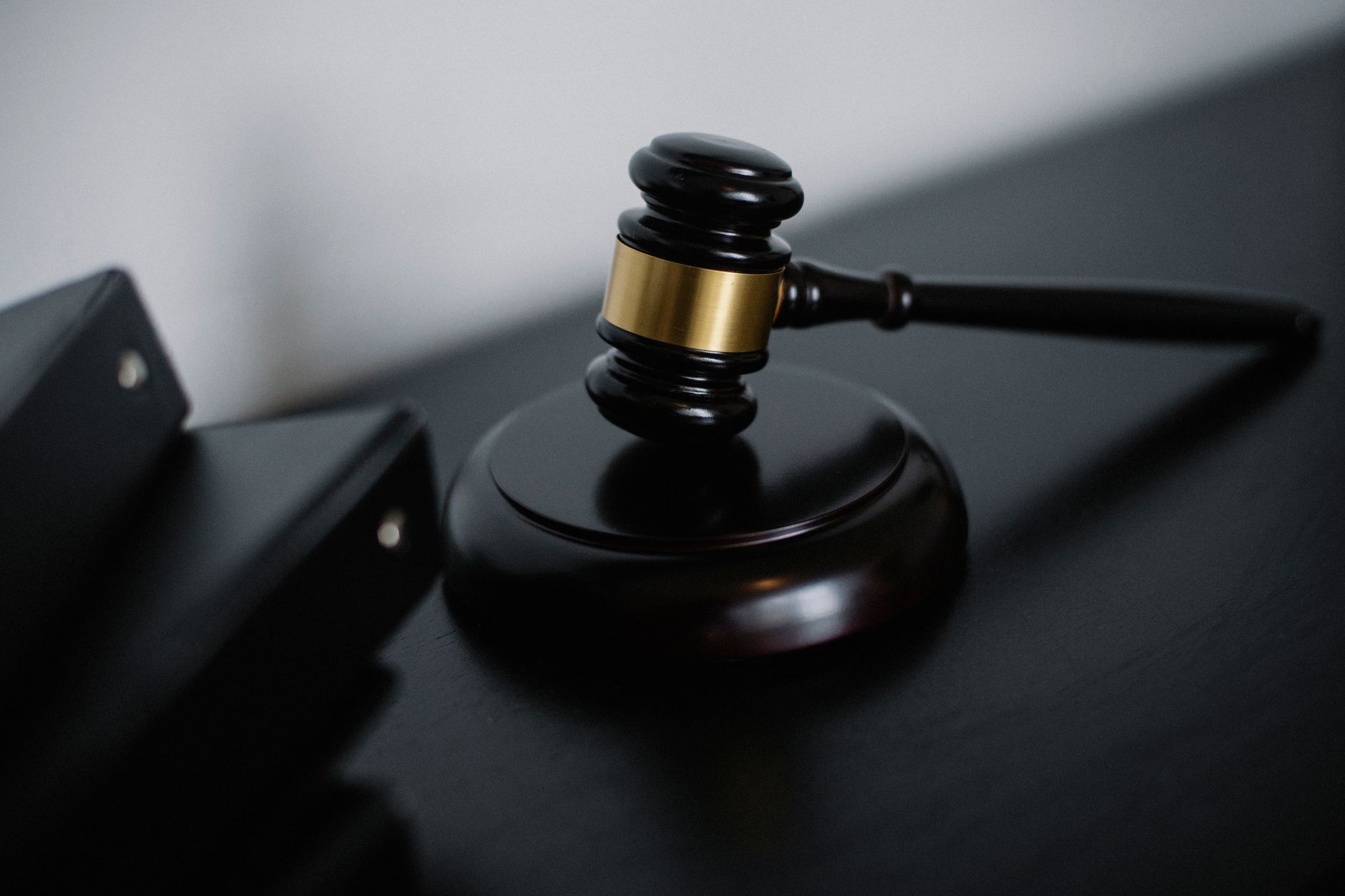 A judge's gavel resting on its sound block, representing a federal court ruling