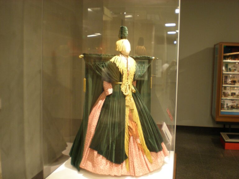 Bob Mackie's green velvet "curtain rod" dress from Carol Burnett's 1976 "Went With the Wind!" sketch, displayed on a mannequin in a glass case at the Smithsonian's National Museum of American History in 2010.