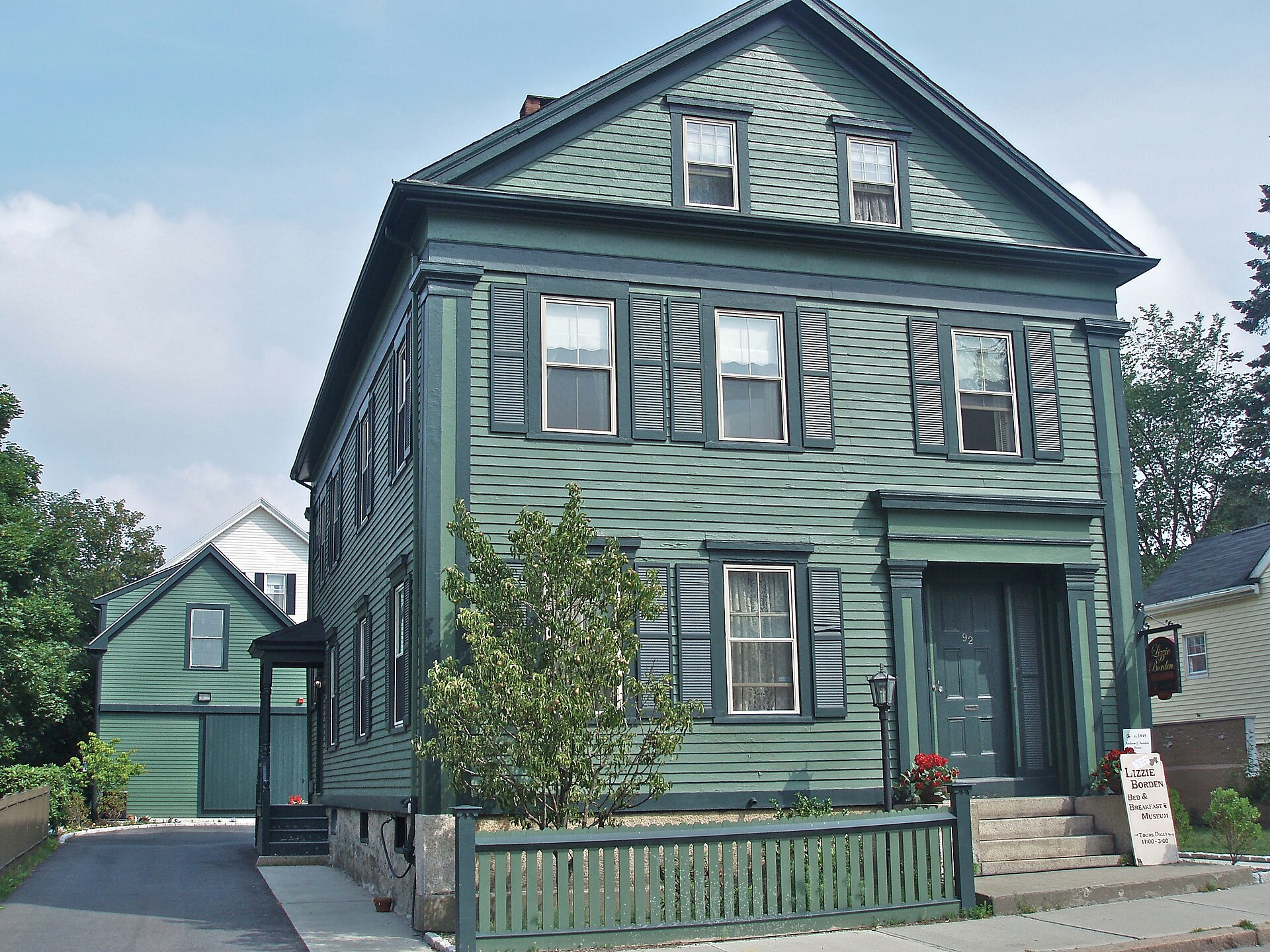 The green two-story Borden house at 92 Second Street in Fall River, Massachusetts, now the Lizzie Borden Bed & Breakfast and Museum.