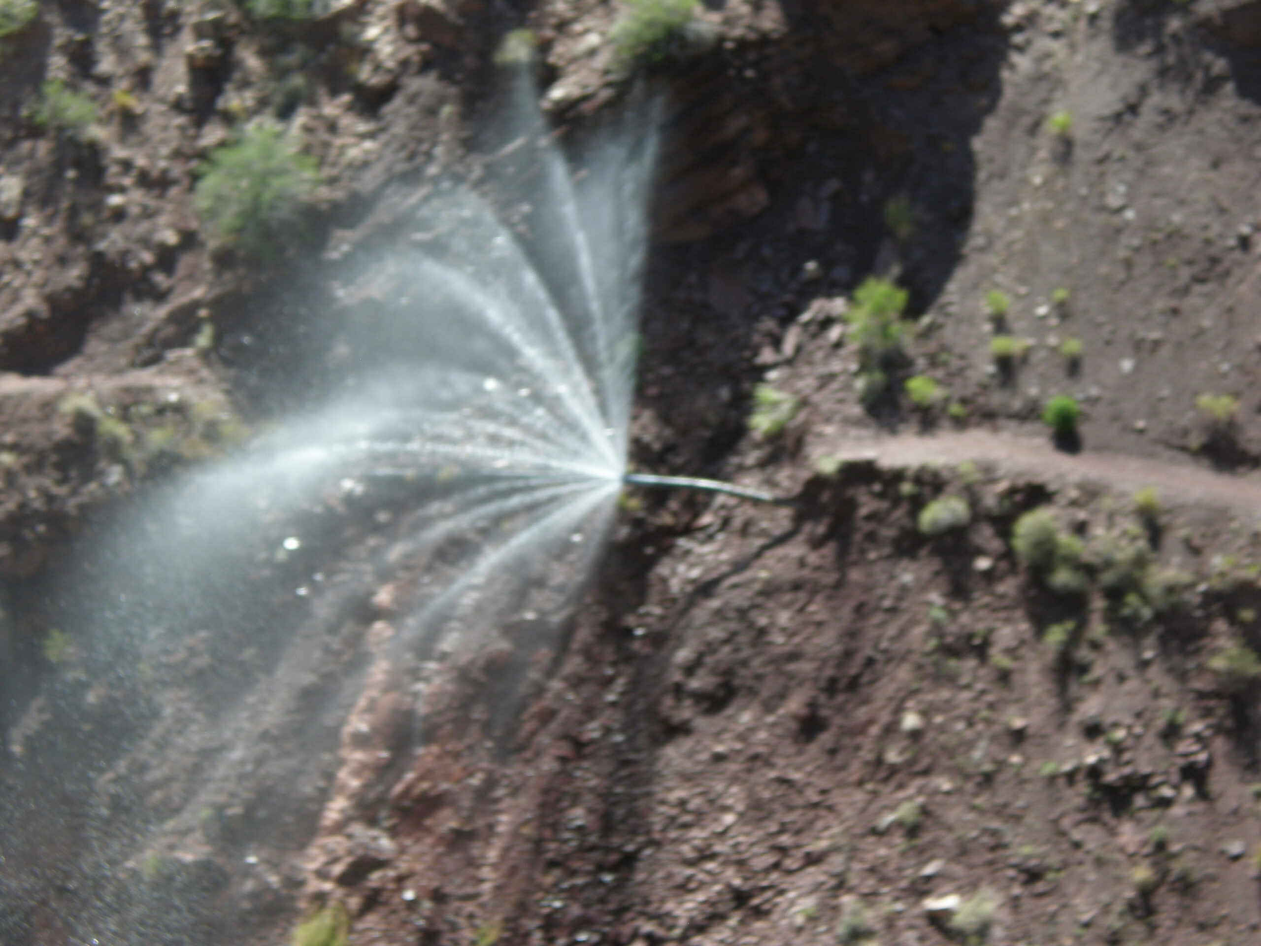 Water spraying from a break in the Transcanyon Waterline in Grand Canyon National Park