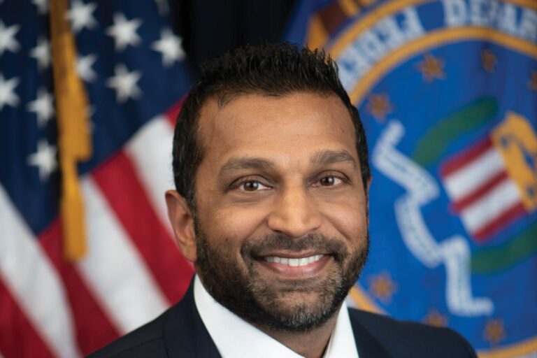 FBI Director Kash Patel in his official FBI portrait, in front of a U.S. flag and the FBI flag.