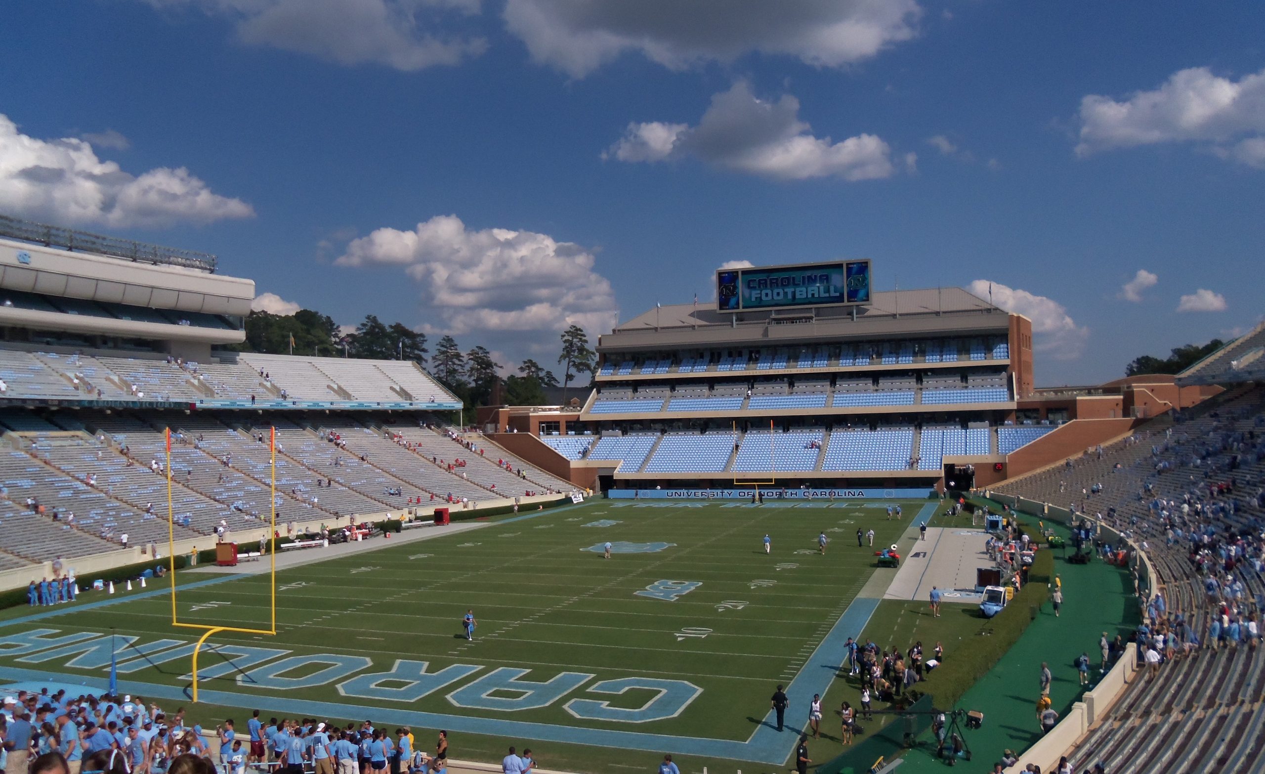 Kenan Memorial Stadium, home of UNC Tar Heels football, showing the Blue Zone stands and Carolina end zone lettering.