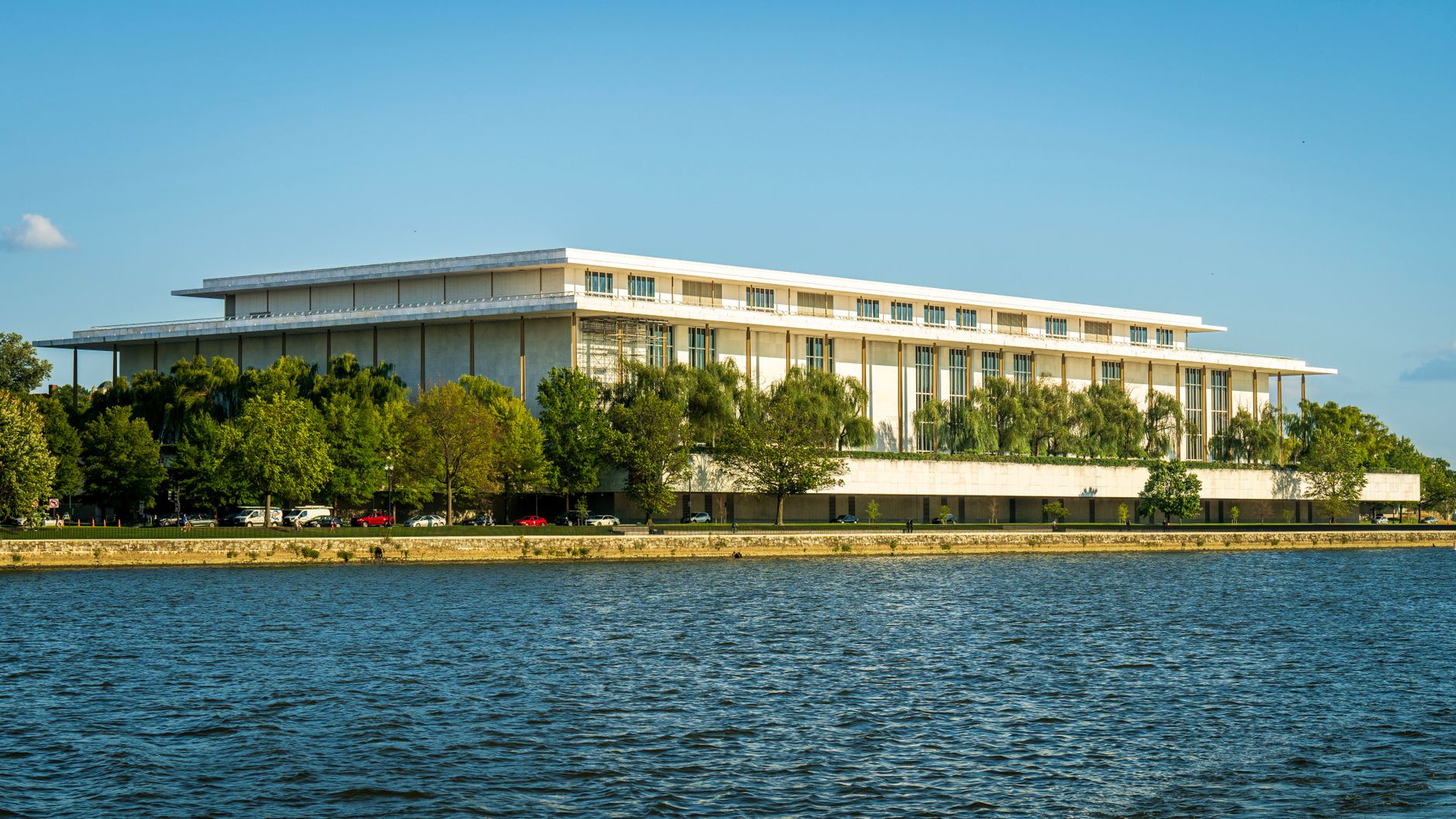 The John F. Kennedy Center for the Performing Arts, seen from across the Potomac River in Washington, on a summer day.