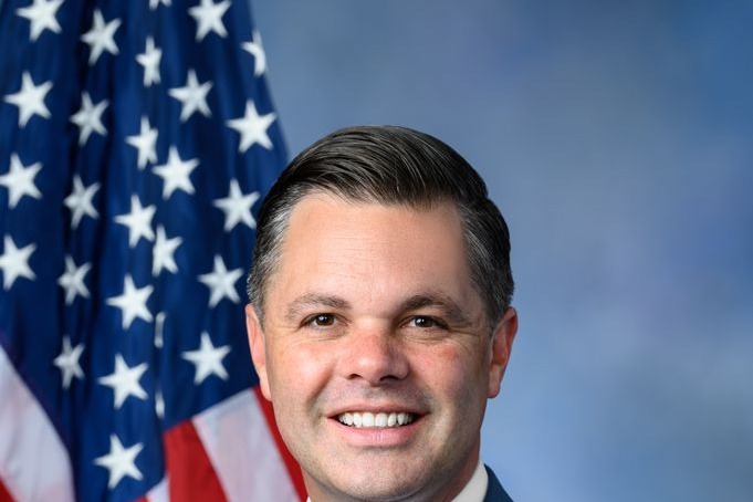 Rep. Zach Nunn, R-Iowa, in his official congressional portrait, in front of a U.S. flag.