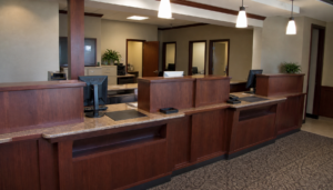 AI-generated illustration: a generic, unbranded community bank teller counter interior