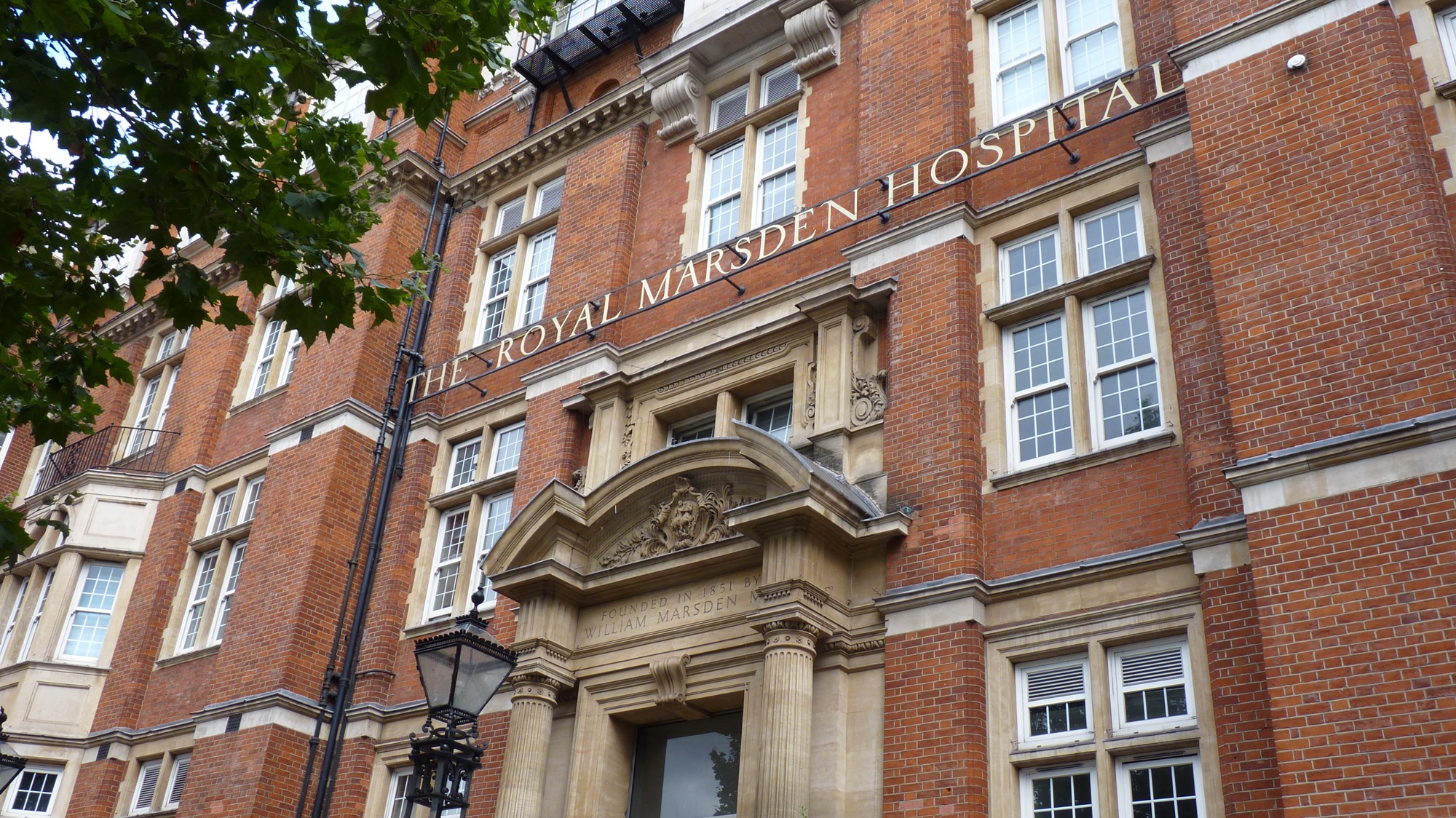 The red-brick front of the Royal Marsden Hospital on Fulham Road in London, with its name in large letters above an arched stone entrance.