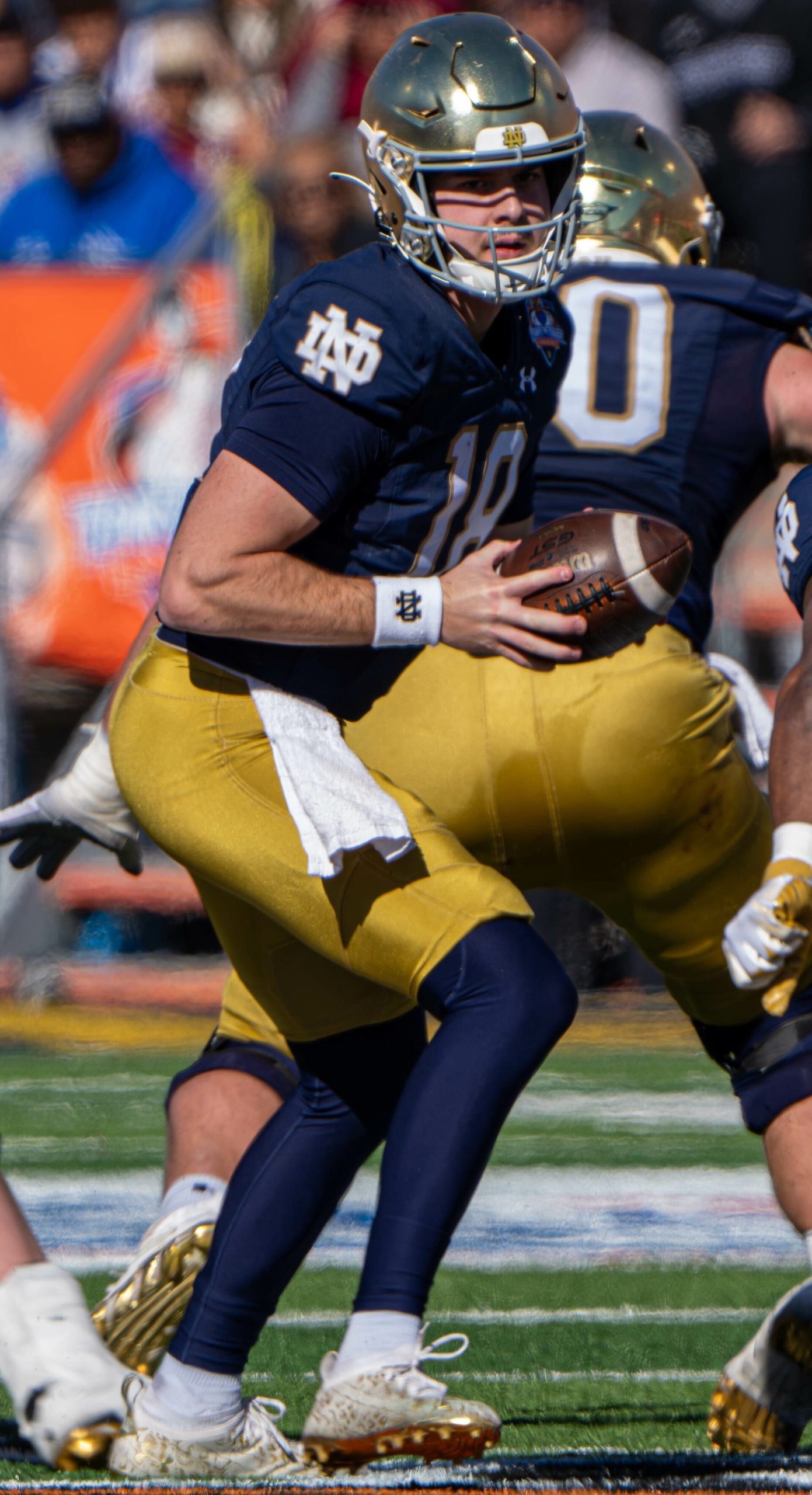 Quarterback Steve Angeli, in a Notre Dame uniform, holding the football during the Sun Bowl in December 2023.