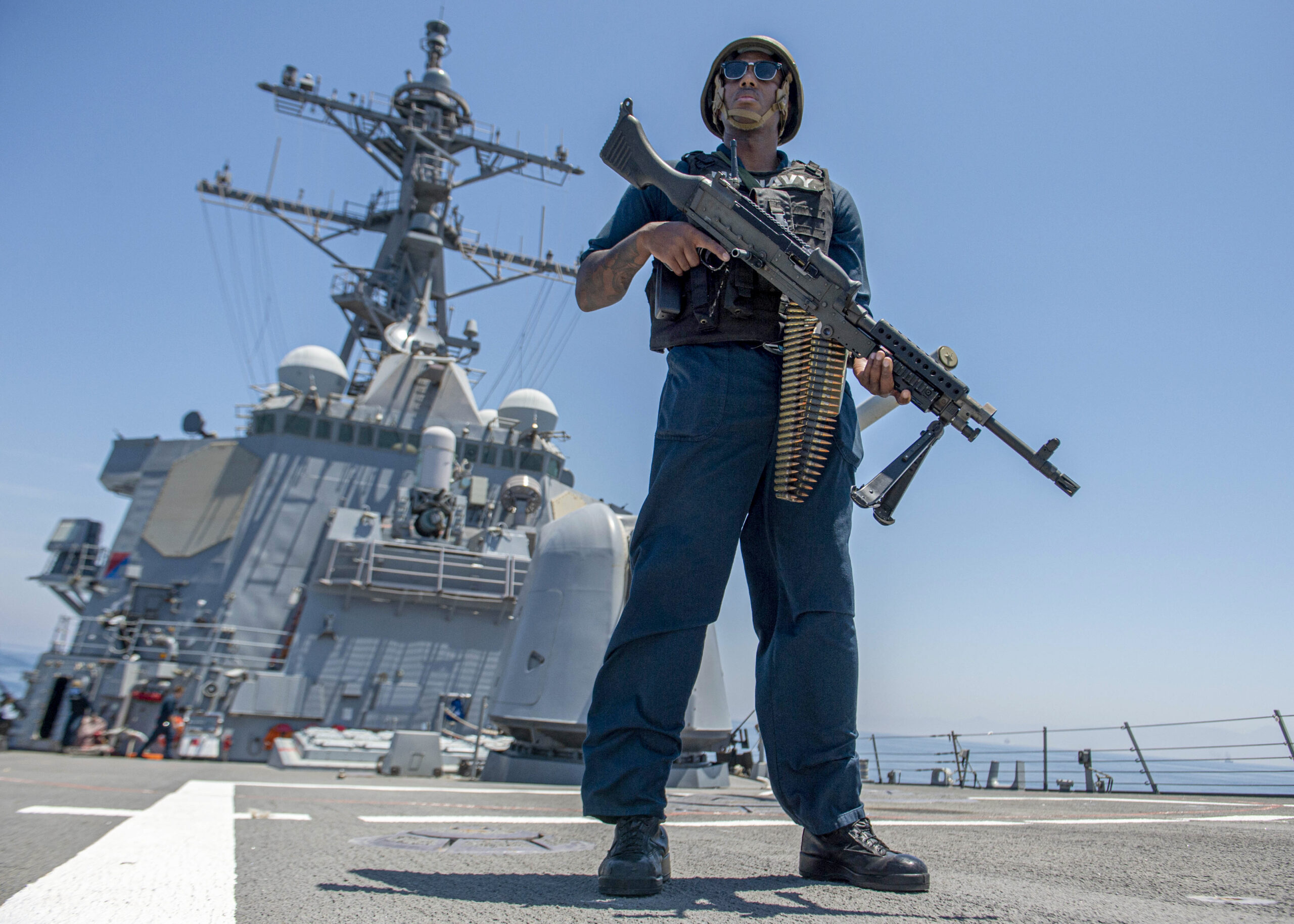 A U.S. Navy sailor stands watch aboard a guided-missile destroyer during a Strait of Hormuz transit (file photo)
