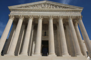 The west front of the U.S. Supreme Court Building in Washington, with its marble columns and the words Equal Justice Under Law carved above them.