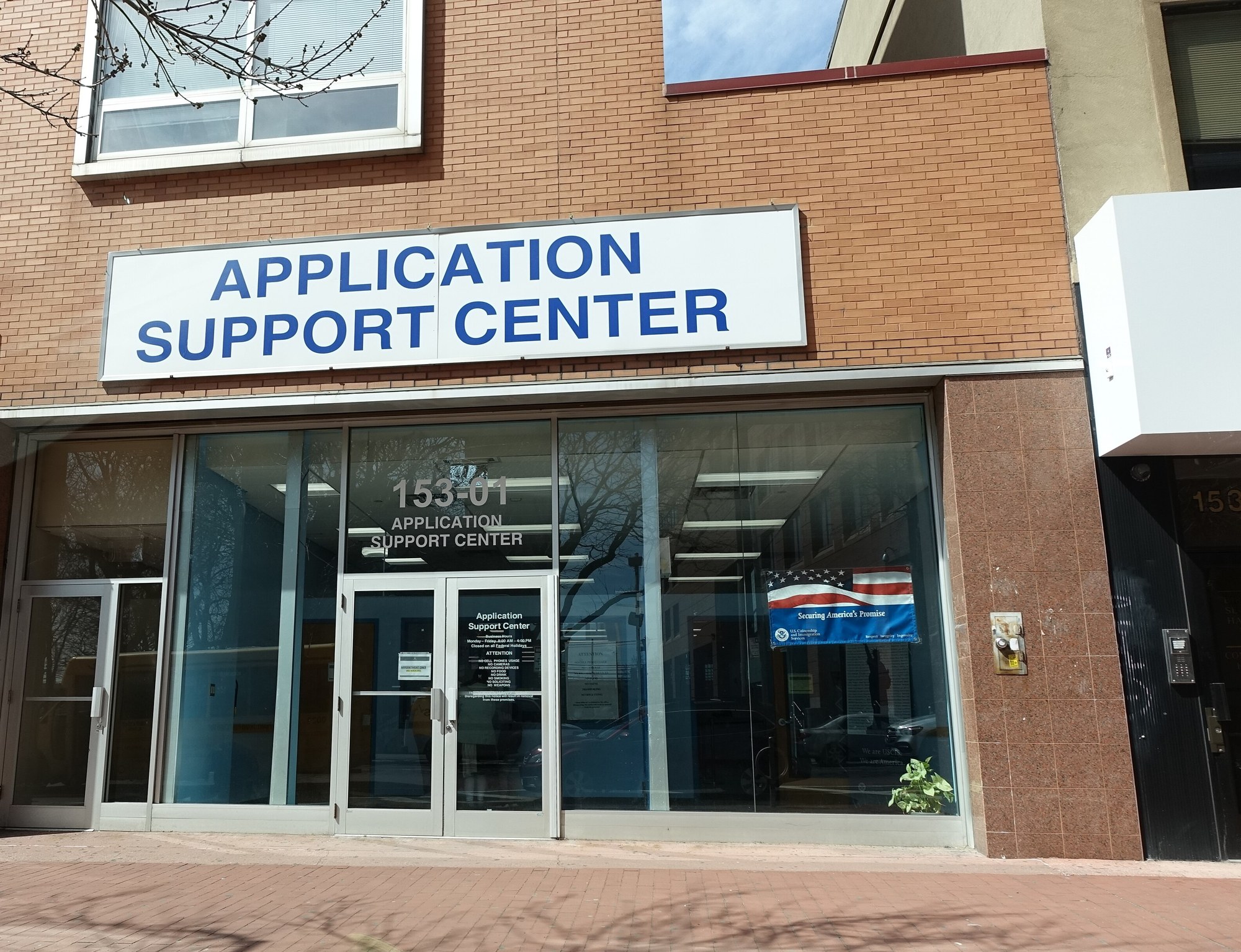 Storefront of a U.S. Citizenship and Immigration Services Application Support Center on Jamaica Avenue in Queens, New York.