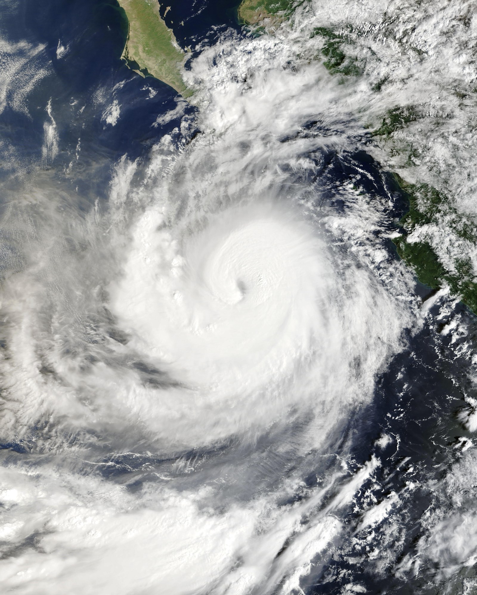 Satellite view of Hurricane Rachel's cloud shield and eye over the eastern Pacific, with the tip of Baja California and the Mexican coast visible at the top.